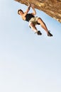 Portrait of Climber Jumping off Cliff Royalty Free Stock Photo