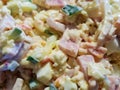 Photo a close-up salad with lots of ingredients richly seasoned with mayonnaise