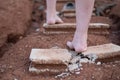 shards of a broken concrete block at woman barefoot at the walking Royalty Free Stock Photo