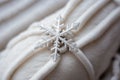 Close-up of a snowflake on a wool mitten