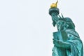 Photo close-up of the Statue of Liberty on a sunny day and blue sky with clouds. Liberty Island. NYC, USA Royalty Free Stock Photo