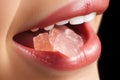 photo close-up of a woman& x27;s mouth holding a gelatin candy