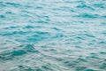 Photo closeup of beautiful clear turquoise sea ocean water surface with ripples low waves on seascape background Royalty Free Stock Photo