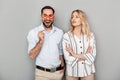 Photo closeup of charming couple in casual clothing smiling with paper fake glasses on stick Royalty Free Stock Photo