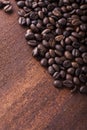 Photo closeup of coffee beans. Rusty background. Royalty Free Stock Photo