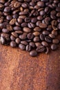 Photo closeup of coffee beans. Rusty background. Royalty Free Stock Photo