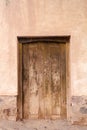 Photo closeup of old aged building made of stone masonry with aged wooden door