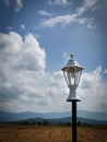 Photo of cludy blue sky with lamp post. Royalty Free Stock Photo