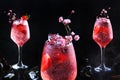 Photo collage. A delicious refreshing drink with strawberry slices and flowers. Ice cubes in the drink.