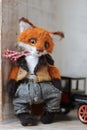 photo of a collectible cunning but kind handmade red fox Teddy, suitable for printing in a calendar card or for