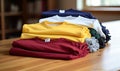 Photo of a colorful display of t-shirts on a rustic wooden table Royalty Free Stock Photo