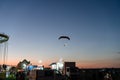Photo of colorful hang glider flying in the sky