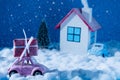 Photo of colorful house snowy road lighted evening sky small blue pink retro car loaded gift xmas fairy miniature family