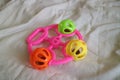 a colorful toddler toy that can make a tinkling sound with a pink handle Royalty Free Stock Photo