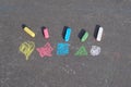 Symbols on asphalt painted by a child with crayons Royalty Free Stock Photo