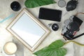 Photo composition-an old film camera, lenses, an empty photo frame and a Cup of coffee Royalty Free Stock Photo