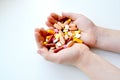 Photo of the composition of tablets, medicines, vitamins, pills in hands. Tablets in sunlight. Royalty Free Stock Photo