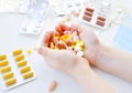 Photo of the composition of tablets, medicines, vitamins, pills in hands. Tablets in sunlight. Royalty Free Stock Photo