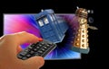 Doctor who tardis chase dalek through space television show remote control hand Royalty Free Stock Photo