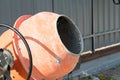 Photo concrete mixer installed on the construction site next to a pile of sand and gravel. Royalty Free Stock Photo