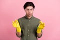 Photo of confident guy hold two chemical tube wear goggles gloves khaki shirt isolated pink color background