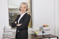 Portrait of confident senior businesswoman with arms crossed in office Royalty Free Stock Photo