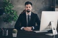 Photo of confident smart business man sit desk computer wear formal suit shirt tie in modern office indoors Royalty Free Stock Photo