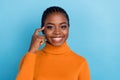 Photo of confident smart positive lady brainstorming concept wear orange shirt isolated blue color background