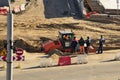 Construction of the bridge. The roller compacts the soil Royalty Free Stock Photo