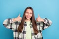 Photo of cool brown hairdo young lady show thumb up wear grey shirt isolated on blue color background