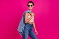 Photo of cool dreamy happy young lady look empty space slim figure outfit isolated on magenta color background Royalty Free Stock Photo