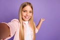 Photo of cool long hairdo pretty girl doing selfie hold empty space wear pink shirt isolated on violet color background Royalty Free Stock Photo