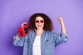 Photo of cool nice girl hold boombox raise fist wear denim shirt isolated on violet color background