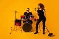 Photo of cool rock group handsome guy playing drum instruments crazy girl sing retro old fashion mic concert show horns