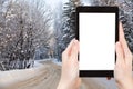 Photo of country road in snowy russian forest