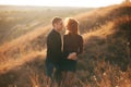 A photo of a couple in the field having a nice time together Royalty Free Stock Photo