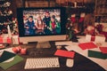 Photo of cozy santa claus house desk computer online video call people good mood noel eve indoors inside home