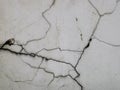 Photo of cracks on white concrete wall. Royalty Free Stock Photo