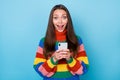 Photo of crazy astonished girl use smartphone addicted blogging impressed social network feedback wear rainbow style Royalty Free Stock Photo