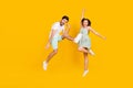 Photo of crazy careless couple rejoice win attainment wear casual outfit isolated yellow color background