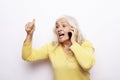 Photo of crazy ecstatic old woman use smartphone impressed social media like feedback win raise fists scream yes Royalty Free Stock Photo