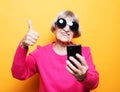 Photo of crazy ecstatic old woman use smartphone impressed social media like feedback win raise fists Royalty Free Stock Photo