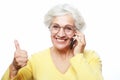 Photo of crazy ecstatic old woman use smartphone impressed social media like feedback win thumb up Royalty Free Stock Photo