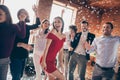 Photo of crazy friends on dance floor x-mas students party listening favorite songs resting bar together little drunk Royalty Free Stock Photo