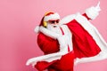 Photo crazy funky cool bearded santa claus enjoy listen headphone stereo x-mas christmas music dance raise finger wear