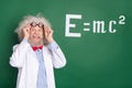 Photo of crazy old professor wear glasses formula board idea mathematics isolated on green color background