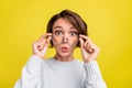 Photo of crazy surprised funny lady open mouth omg face wear glasses blue pullover isolated yellow color background