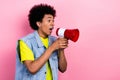 Photo of crazy young person arms hold loudspeaker say tell empty space isolated on pink color background