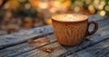 a photo of a cup of coffee latte latte art and pattern on top of an outdoor wooden table, in the style of motion blur Royalty Free Stock Photo