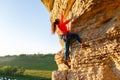 Photo of curly-haired climber girl climbing rock Royalty Free Stock Photo